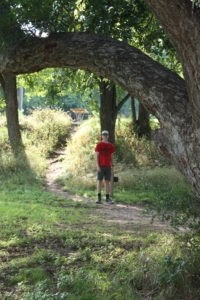 Photo of Ian standing on the path from the parking lot to our campsite.